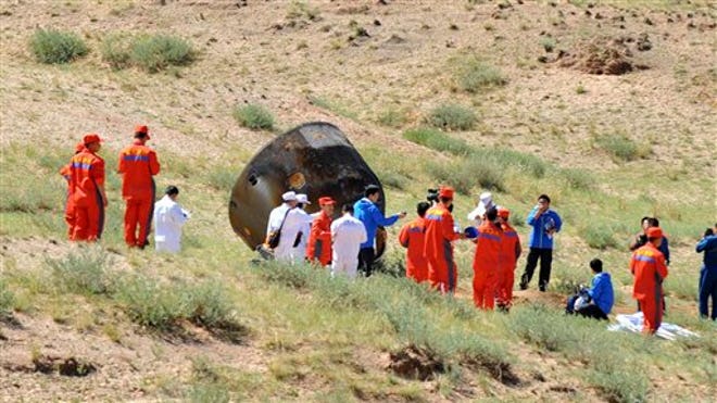 chinese astronauts inspect.jpg